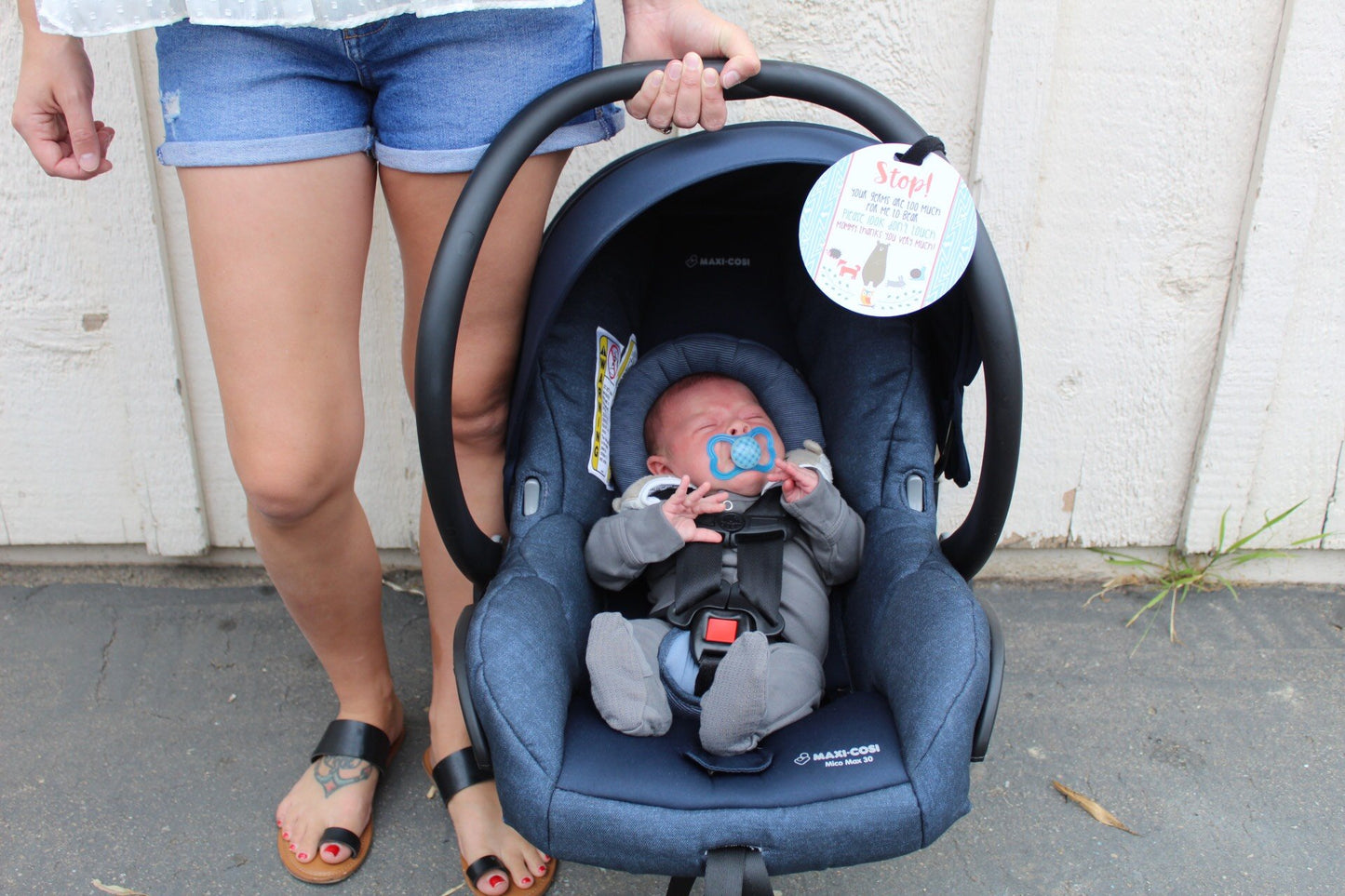 Newborn baby boy woodlands car seat sign to not touch baby stroller