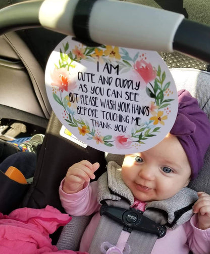 Newborn baby girl car seat sign to not touch baby