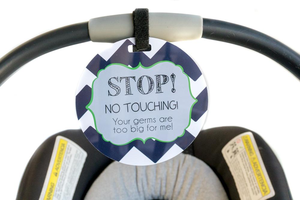 Newborn baby boy seahawk car seat sign to not touch baby stroller